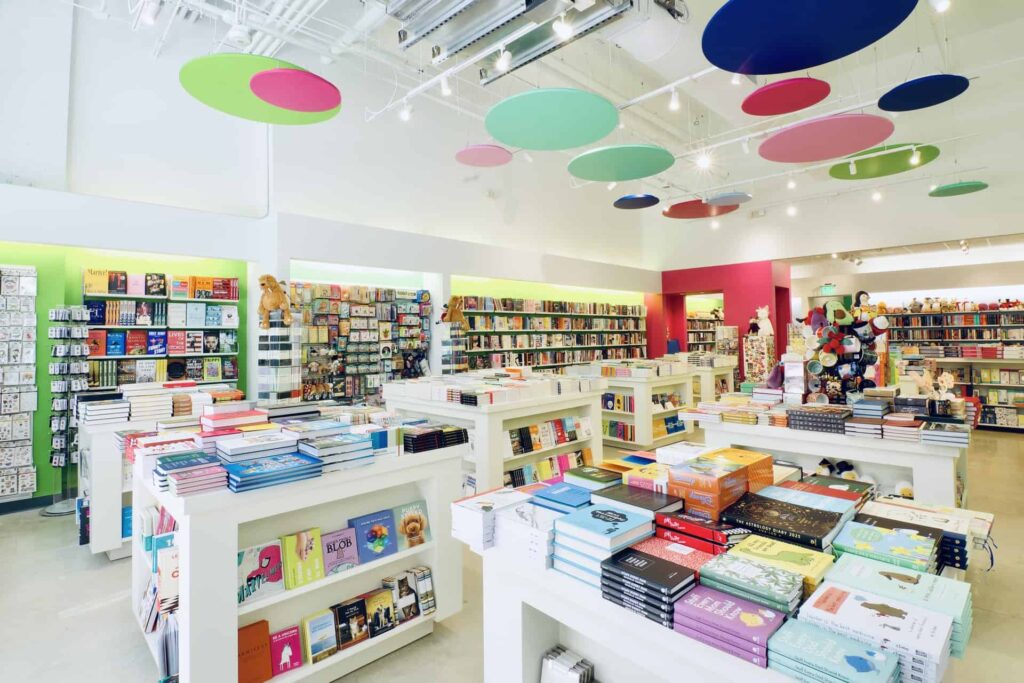 Posman Books interior at Miami Worldcenter with colorful shelves full of books