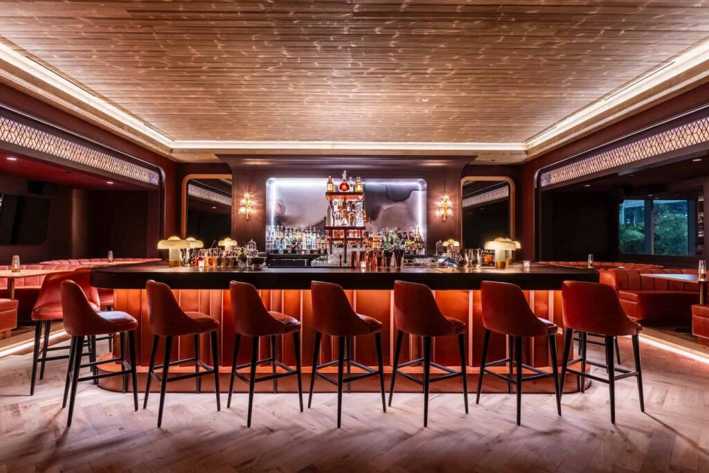 Maple & Ash bar lined with high-counter stools