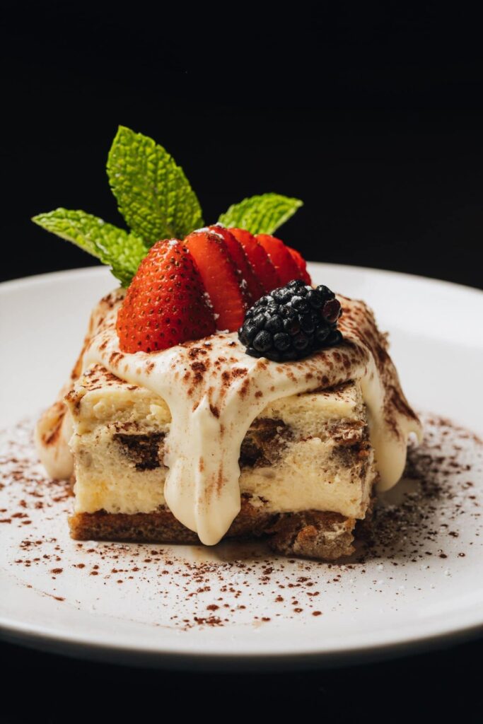 Slice of tiramisu from Serafina topped with mixed berries