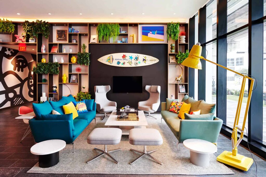 Common sitting area with colorful couches at citizenM Miami Worldcenter Hotel