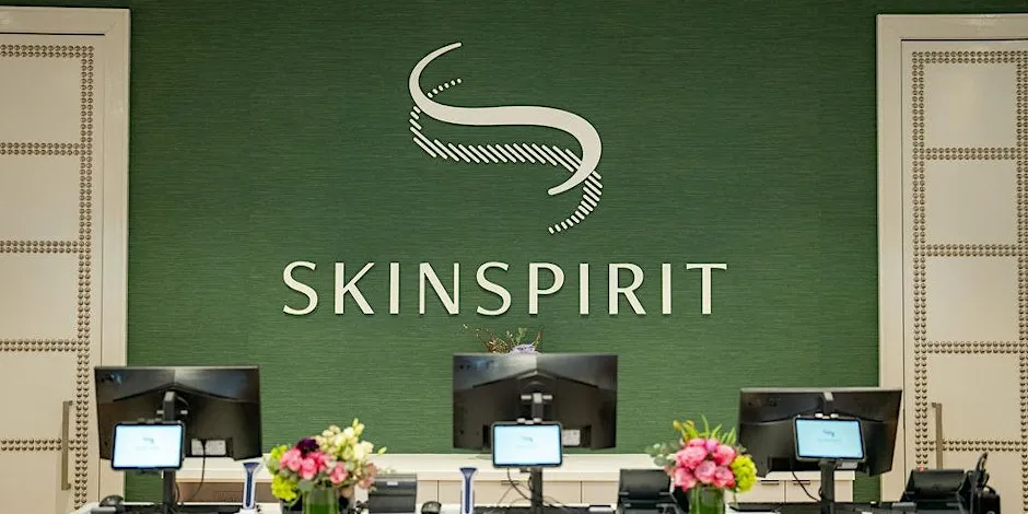 SkinSpirit front desk decorated with floral arrangements