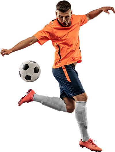 Soccer player kicking soccer ball
